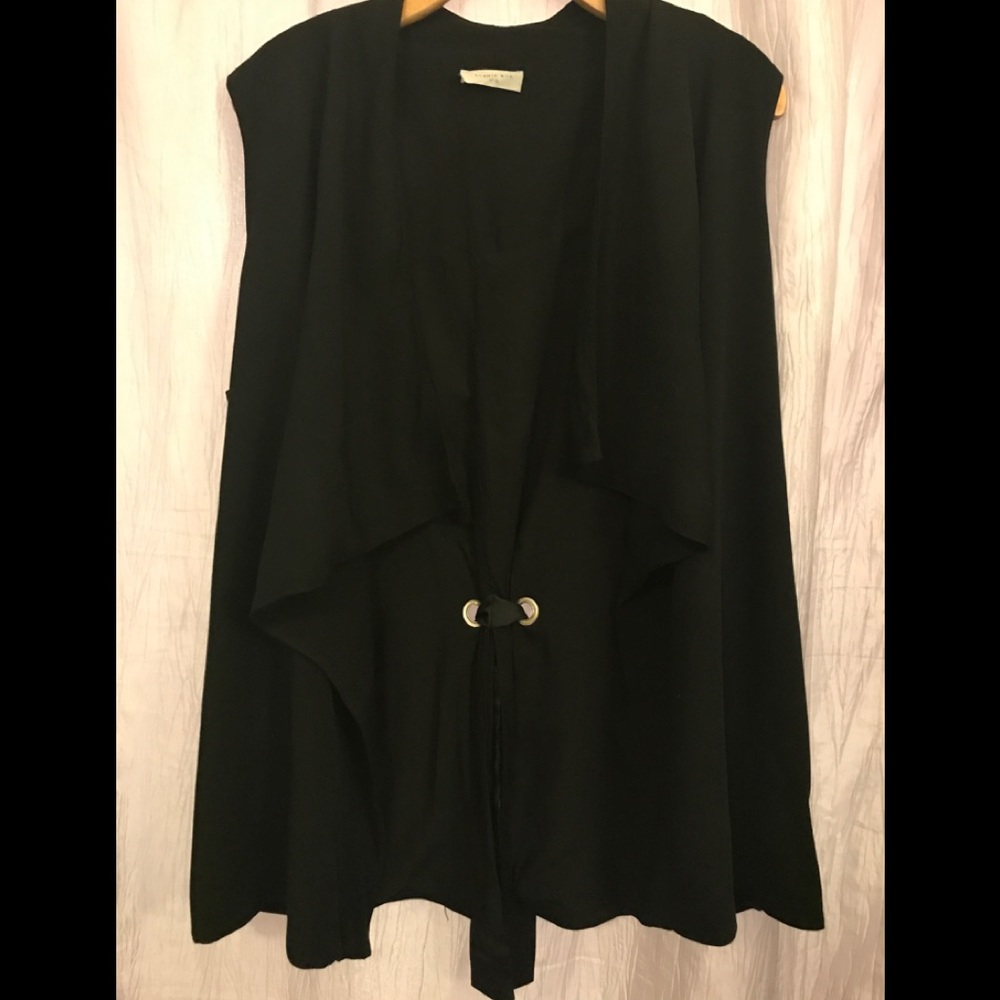 Sleeveless duster, grosgrain bow design in back.